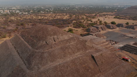 Drone-view-of-Pyramid-of-Moon-peak-in-Teotihuacan-complex-in-Mexico-Valley.-Birds-eye-revealing-the-Temple-of-Sun-and-Citadel-complex.-Ancient-mesoamerican-city,-unesco-world-heritage