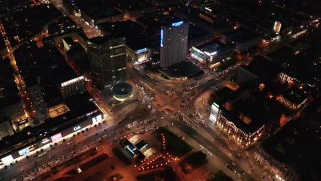 Aerial-footage-of-large-multilane-roundabout-in-night-city.-Heavy-traffic-in-evening-rush-hour.-Warsaw,-Poland