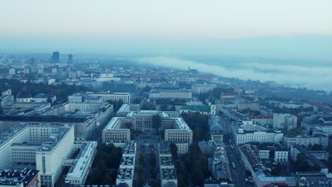Forwards-fly-above-town-development.-Large-government-buildings-and-palaces.-Morning-view-before-sunrise.-Warsaw,-Poland
