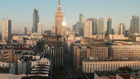 Forwards-fly-above-morning-city.-Revealing-downtown-skyscrapers-and-historic-high-rise-PKIN-building-in-soviet-style.-Warsaw,-Poland