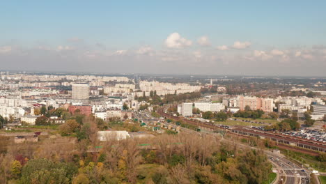 Panoramic-view-of-vast-housing-estate.-Trunk-road-and-railway-track-leading-through-city.-Warsaw,-Poland