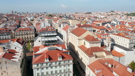 Aerial-dolly-in-view-of-traditional-European-architecture-with-colorful-houses-in-urban-city-center-of-Lisbon,-Portugal