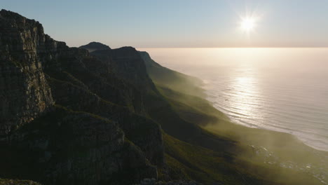 Beautiful-shot-of-mountain-landscape-along-sea-coast.-Forwards-fly-above-Table-Mountain-National-Park.-Cape-Town,-South-Africa