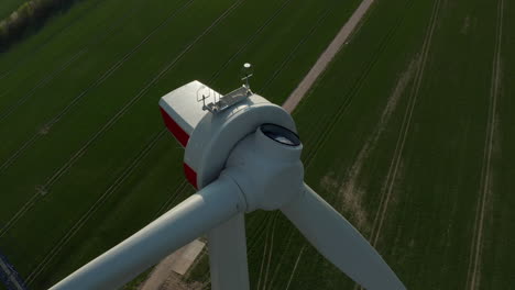 Orbit-shot-about-top-of-wind-power-station.-Assembling-of-rotor-on-site.-Green-energy,-ecology-and-carbon-footprint-reduction-concept