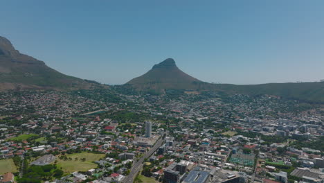 Aerial-panoramic-footage-of-urban-neighbourhood.-Lions-Head-Mountain-in-background.-Cape-Town,-South-Africa
