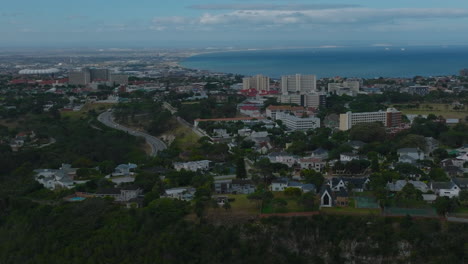 Aerial-panoramic-footage-of-city-around-sea-bay.-Various-residential-buildings-in-urban-borough.-Port-Elisabeth,-South-Africa