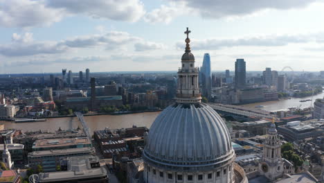 Tight-fly-around-top-of-Saint-Pauls-Cathedral.-Aerial-view-of-River-Thames-and-its-south-bank-with-Tate-Modern-art-gallery-and-One-Blackfriars-skyscraper.-London,-UK