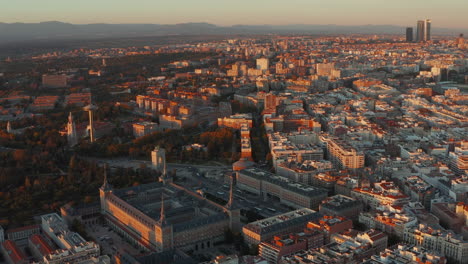 Aerial-view-of-historic-building-with-spires-in-corners.-Panoramic-footage-of-city-at-sunset.