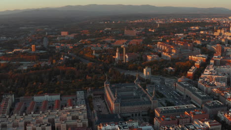 Aerial-panoramic-footage-of-city-at-dusk.-Government-buildings,-hospital-and-university-site-in-Moncloa--Aravaca-district.
