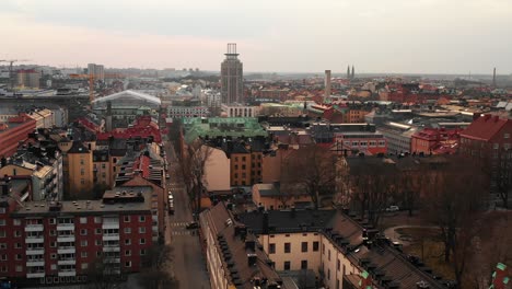 Rising-drone-footage-revealing-aerial-panoramic-view-on-town-neighbourhood.-Cityscape-from-height.-Stockholm,-Sweden