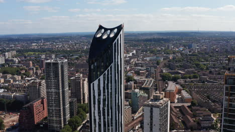 Elevated-view-of-Strata-skyscraper.-Tall-multistorey-apartment-building-in-Elephant-and-Castle.-Wind-turbines-integrated-to-top-part-of-structure.-London,-UK