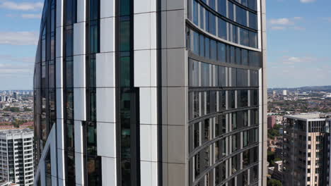Orbiting-around-Strata-tall-apartment-building.-Modern-design-facade-of-skyscraper-closeup.-London,-UK