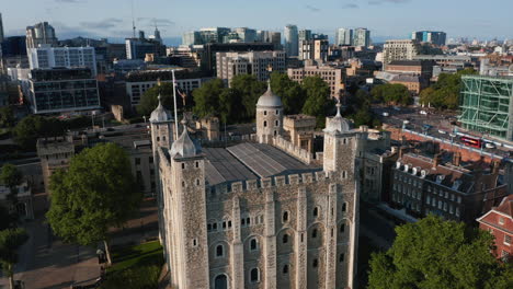 Aerial-view-of-medieval-keep-White-Tower.-Historic-landmark-Tower-of-London-in-bright-afternoon-sun.-London,-UK