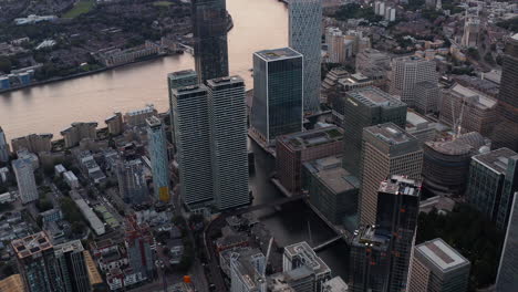 High-angle-view-of-Canary-Wharf-office-buildings.-Water-channel-between-skyscrapers-in-former-docks.-London,-UK
