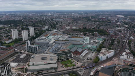 Aerial-panoramic-view-cityscape.-Development-in-urban-neighbourhoods.-Large-shopping-mall-Westfield-in-foreground.-London,-UK