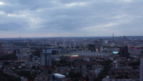 Panoramic-view-of-cityscape-at-dusk.-Waterloo-train-station-and-London-Eye-tourist-attraction.-London,-UK