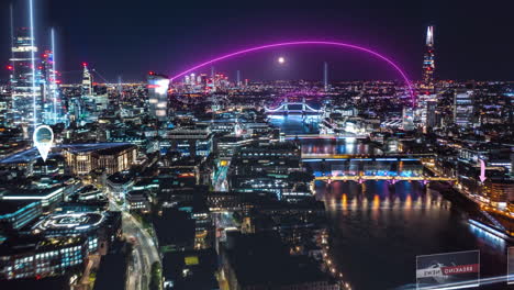 Forwards-fly-above-night-city.-Hyper-lapse-shot-of-Thames-River-and-surrounding-buildings-enhanced-by-augmented-reality-information.-London,-UK