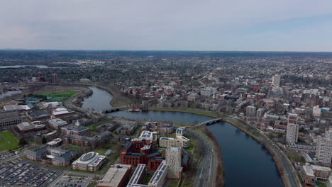 Forwards-fly-above-Charles-river.-Harvard-University-and-Business-school-on-waterfront-from-height.-Boston,-USA