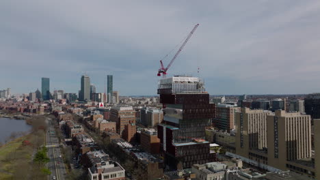 Tall-tower-crane-on-new-building-construction-site.-Boston-University-faculty-of-Computing-and-Data-Sciences.-Boston,-USA