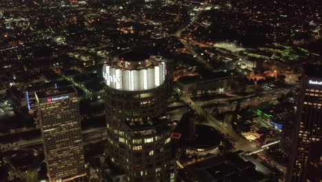Big-Skyscraper-Towers-in-an-American-City-metropolitan-Area-at-Night-with-lit-up-Streets,-Aerial-Drone-View-from-Above,-Los-Angeles,-Circa-2019