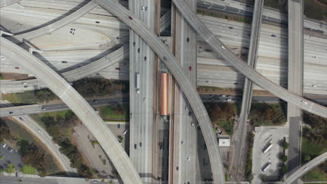 AERIAL:-Spectacular-Overhead-follow-Shot-of-Judge-Pregerson-Interchange-showing-multiple-Roads,-Bridges,-Highway-with-little-car-traffic-in-Los-Angeles,-California-on-Beautiful-Sunny-Day