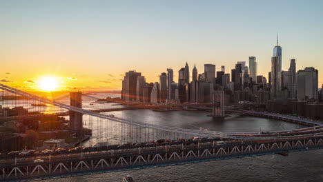 Picturesque-hyperlapse-footage-of-flight-over-big-cable-stayed-bridges-at-romantic-sunset.-Group-of-modern-downtown-skyscrapers.-Manhattan,-New-York-City,-USA