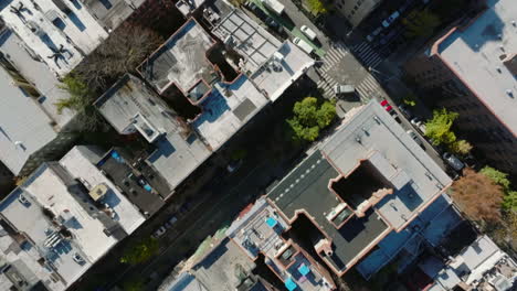 Aerial-birds-eye-overhead-top-down-panning-view-of-blocks-of-apartment-buildings-in-residential-urban-neighbourhood.-Manhattan,-New-York-City,-USA