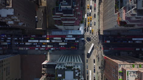 Aerial-birds-eye-overhead-top-down-view-of-streets-and-intersection-clogged-by-vehicles.-Heavy-traffic-in-city.-Manhattan,-New-York-City,-USA