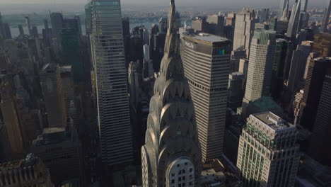 Aerial-descending-close-up-view-of-top-of-Chrysler-building-with-distinctive-Art-Deco-crown-and-spire.-Manhattan,-New-York-City,-USA