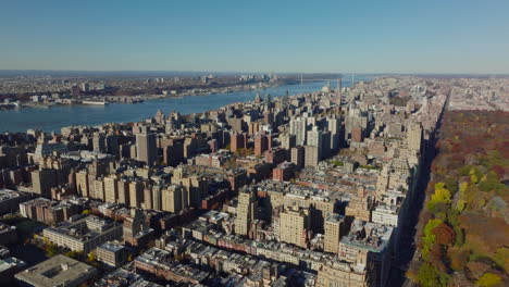Aerial-panoramic-view-of-Upper-West-Side-neighbourhood-between-Hudson-River-and-autumn-Central-Park.-Manhattan,-New-York-City,-USA