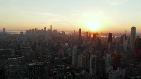 Picturesque-sunset-above-city-development-with-tall-downtown-skyscrapers.-Manhattan,-New-York-City,-USA