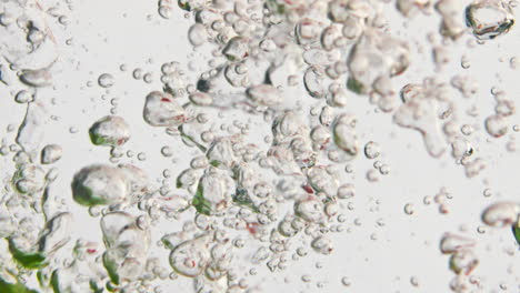 Fresh-vegetables-falling-water-in-bubbles-closeup.-Fresh-colorful-cucumbers