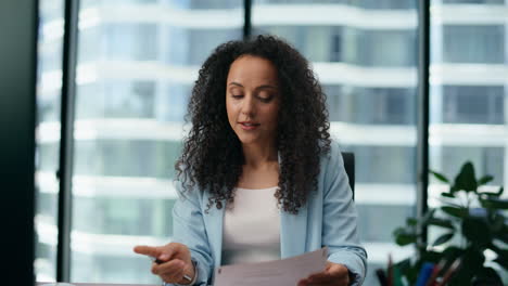 Woman-sitting-education-webinar-in-office-close-up.-Woman-taking-courses-online.