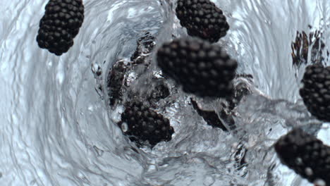 Bramble-tossing-swirling-cocktail-glassware-top-view.-Detox-liquid-whirlpool