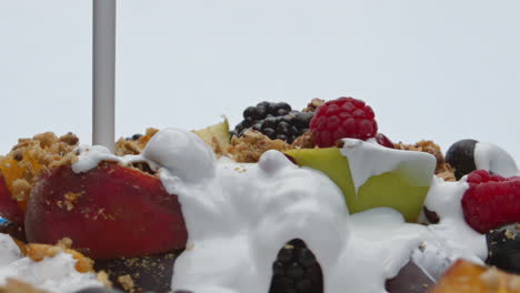 Muesli-poured-natural-yogurt-in-super-slow-motion-closeup.-Homemade-vitamin-food