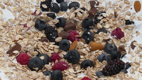 Fresh-cereal-creamy-breakfast-with-wheat-flakes-chokolade-nuts-berries-closeup.