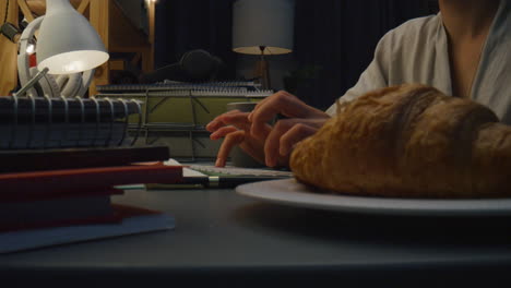 Unrecognizible-woman-browsing-keyboard-house-closeup.-Lady-hands-typing-device