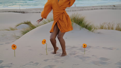 Woman-performer-dancing-seashore-at-summer-twilight.-Girl-moving-beautifully.