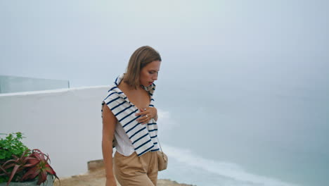 Woman-looking-sea-cliff-view-on-summer-trip.-Upset-young-girl-thinking-problems