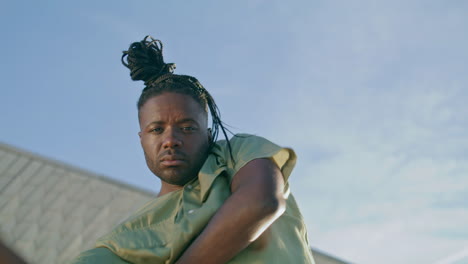 Dreadlocks-guy-dancing-hands-portrait.-Man-performing-contemporary-choreography