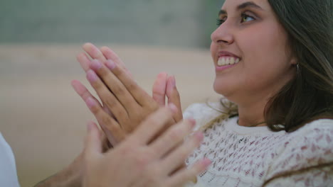 Laughing-woman-bonding-man-at-beach-closeup.-Unknown-boyfriend-warming-lady-arms