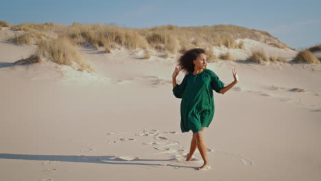 Woman-dancing-sensually-desert-summer-time.-Wind-blowing-on-dance-performer.