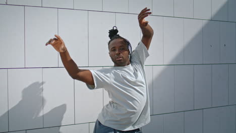 Expressive-dancer-performing-dance-vertical-closeup.-Brown-skin-man-rehearsing