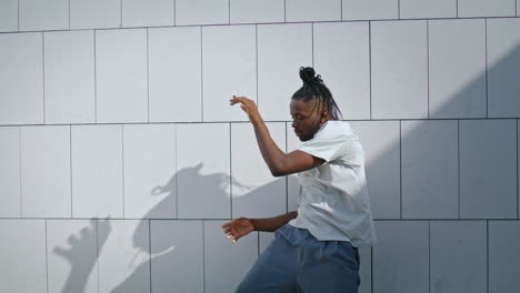 Plastic-man-rehearsing-dance-at-street-closeup.-Dancer-doing-sensual-moves