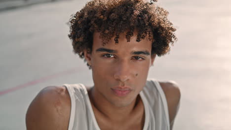 Serious-teenager-looking-camera-street-portrait.-Young-student-resting-vertical