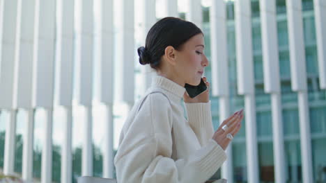 Business-woman-talking-smartphone-going-to-office-close-up.-Lady-calling-phone.