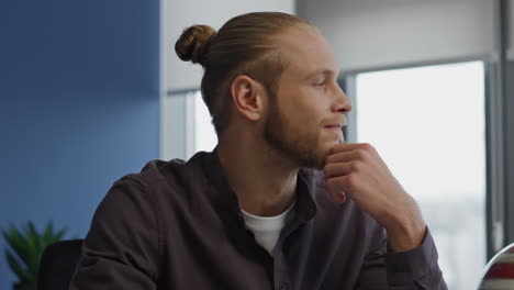 Thinking-man-working-office-portrait.-Focused-freelancer-watching-window-closeup