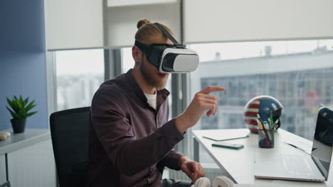 Futuristic-streamer-playing-metaverse-at-flat-closeup.-Vr-glasses-man-exploring