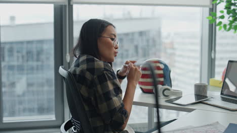 Pensive-copywriter-thinking-office-city-view.-Eyeglasses-woman-looking-solution
