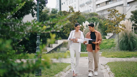 Serious-partners-working-on-go-at-path.-Relaxed-business-couple-walking-nature